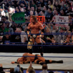 Triple H standing over Randy Orton - Wrestling Examiner